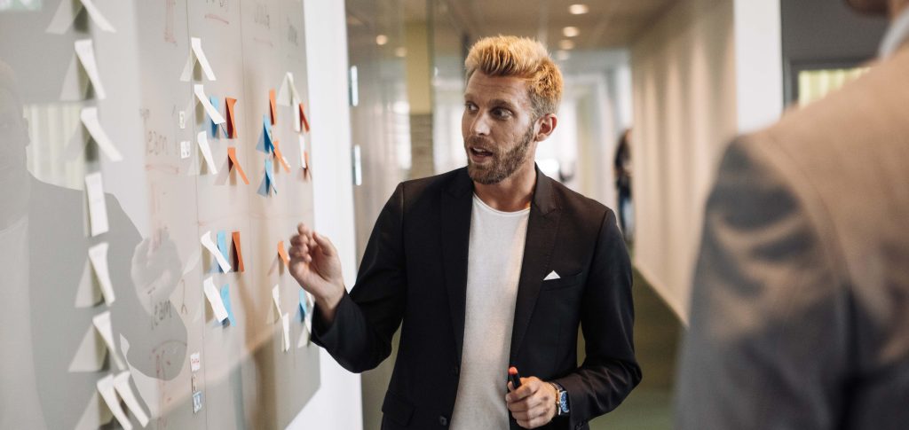 Softronic employee working with post-its